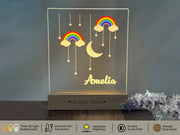 a glass block with a rainbow and clouds on it