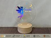 a personalized glass ornament with a fairy on it