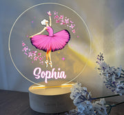 a personalized acrylic sign with a ballerina in a pink dress