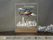 a glass block with a picture of a helicopter flying over a city
