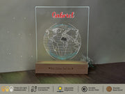 a glass globe on a wooden stand on a table