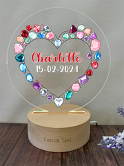 a heart shaped acrylic with a name on it
