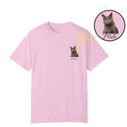 a pink t - shirt with a picture of a cat and a yellow circle