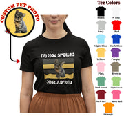 a woman wearing a t - shirt with a picture of a cat on it