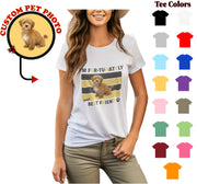 a woman wearing a t - shirt with a picture of a dog on it