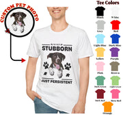 a man wearing a t - shirt with a picture of a dog on it