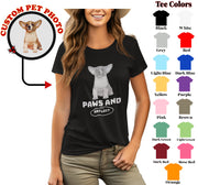 a woman wearing a t - shirt with a picture of a dog on it
