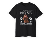 a black t - shirt with a brown dog's face and paw prints