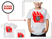 a young boy wearing a custom soccer t - shirt