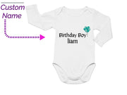 a baby bodysuit with a name and a picture of a shamrock