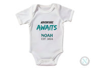 a white onesuit with the words, adventure awaits noah est 2013