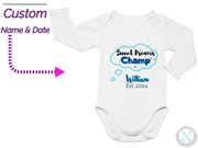 a baby bodysuit with a name and date on it