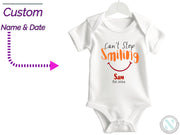 a baby bodysuit with a smile on it