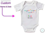 a baby bodysuit with a name and date on it