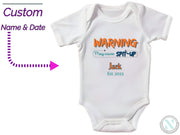 a white bodysuit with the words warning on it