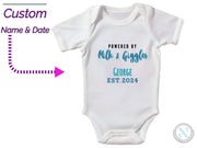 a baby bodysuit with the words, powered by milk and grace george est 2012