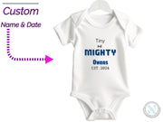 a white onesuit with the words tiny and mighty on it