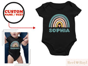a baby bodysuit with a rainbow and name on it