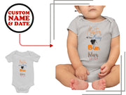 a white bodysuit with a black dog on it