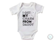 a white bodysuit that says i get my charm from daddy