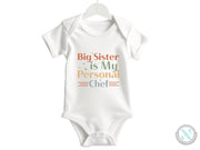 a baby bodysuit that says, big sister is my personal chef