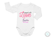 a white bodysuit with the words engaged with love on it