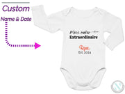 a white bodysuit with a name and date on it