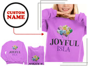 a woman wearing a purple shirt with a picture of a bunch of balloons on it