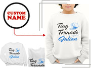 a woman wearing a white sweatshirt with custom name on it