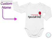 a white onesuit with a red balloon on it