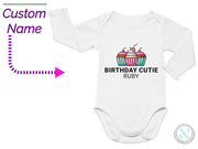 a baby bodysuit with a cupcake on it