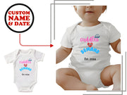 a white bodysuit with the words cuddles on it