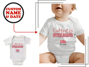 a white bodysuit with the words cutness overloaded on it