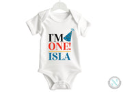 a baby bodysuit with the words i'm one island printed on it
