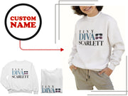 a woman wearing a white sweatshirt with custom name on it