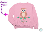 a pink sweatshirt with an owl on it