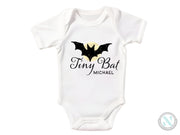 a white bodysuit with a bat on it