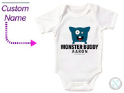 a white bodysuit with a blue monster on it