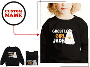 a girl wearing a black ghost sweatshirt and matching shirt