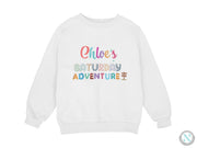 a white sweatshirt with the words child's saturday adventure printed on it