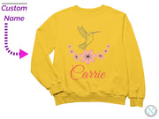 a yellow sweatshirt with a humming bird on it