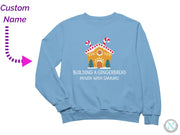 a blue sweatshirt with a gingerbread house on it