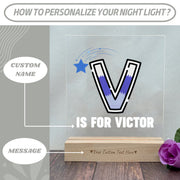 a glass block with a picture of a letter v and the words is for victory