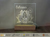 a glass block with a picture of a house on it