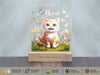 a picture of a cat on a wooden stand