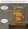 a personalized light with a teddy bear on it