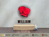 a wooden block with a picture of a boxing glove on it