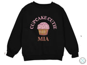 a black sweatshirt with a cupcake cutie on it