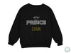 a black sweatshirt with the words prince and a crown on it