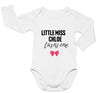a white bodysuit with a pink bow on it